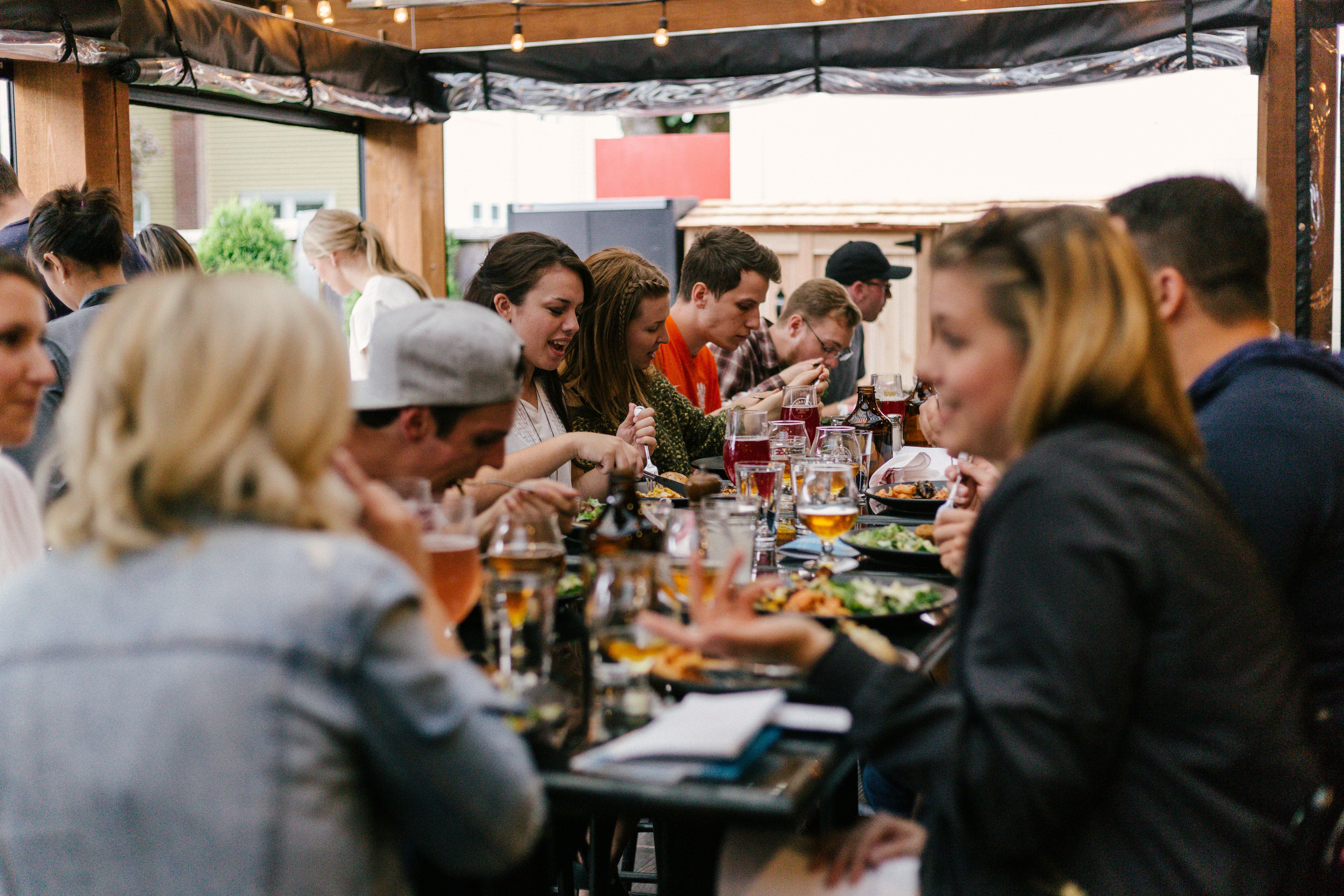 Picture taken of a group of people eating all together